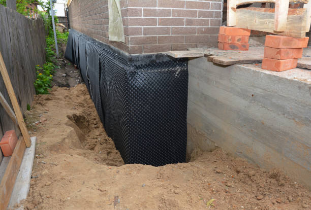 Happy homeowners after waterproofing job in Sawyer